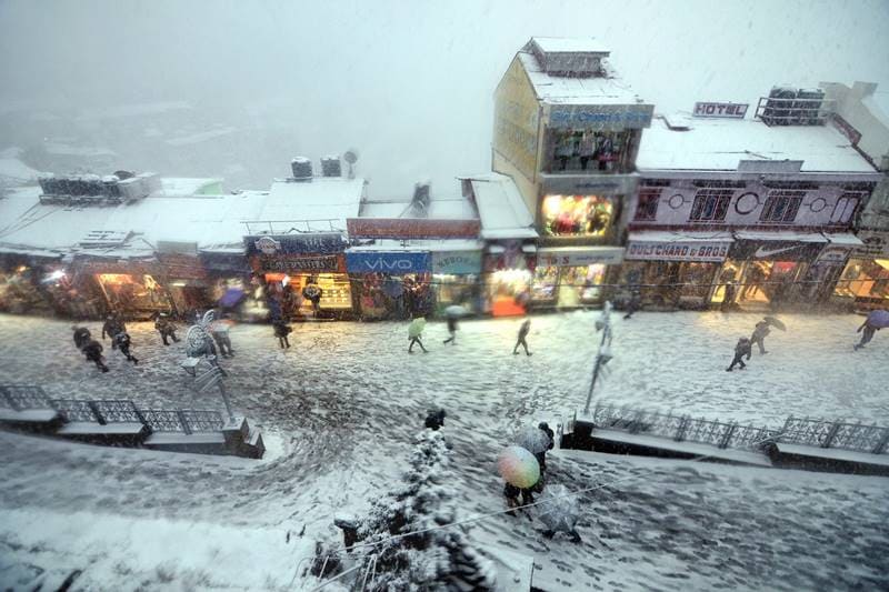 As news of the snowfall spread, tourists flocked to Shimla, known for the imperial grandeur of its buildings that were once institutions of power when the town served as the summer capital of British India. (PTI Photo)