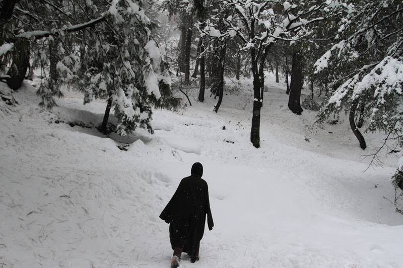 The Trikuta Hills housing the holy Mata Vaishno Devi Shrine in Reasi district received the season's first snowfall. (Image: Indian Express Photo)