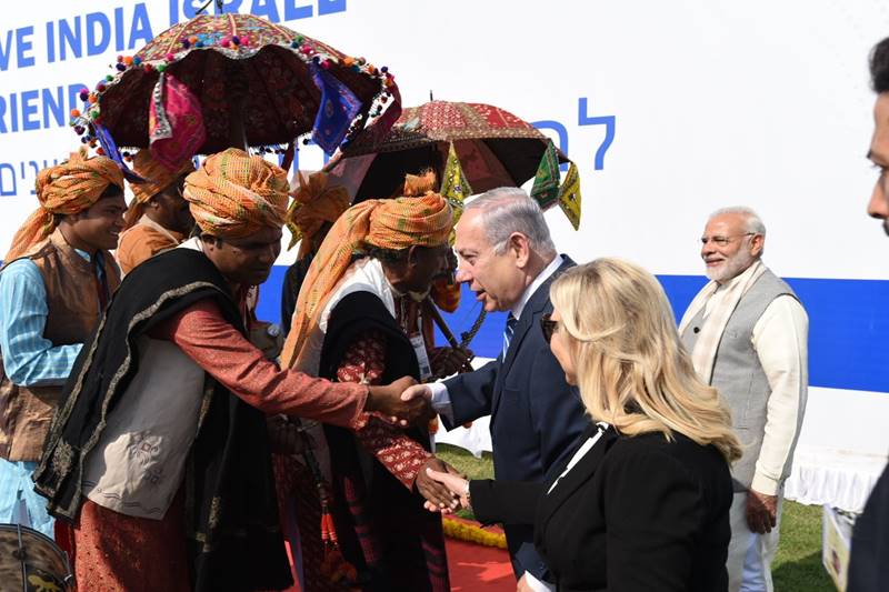 Prime Minister Narendra Modi and his Israeli counterpart Benjamin Netanyahu embarked on a eight-km long roadshow from the airport to Sabarmati Ashram today. After arriving in Modi's home state, the two leaders along with the Israeli prime minister's wife Sara Netanyahu set out in a car from the Sardar Vallabhbhai Patel Airport here. The roadshow will end at the Sabarmati Ashram after covering a distance of 8 kms. Around 50 stages have been erected on the roadside along the stretch to showcase performances by troupes of different states to welcome the guests, Ahmedabad Municipal Corporation's standing committee chairman Pravin Patel earlier said. (Image: Twitter/Narendra Modi)