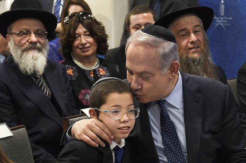 Moshe Holtzberg, who as a toddler survived the terrorist attack on Chabad House in south Mumbai in November 2008, prayed at the synagogue there today for the miracle which kept him alive, said his grandfather. (PTI Photo)