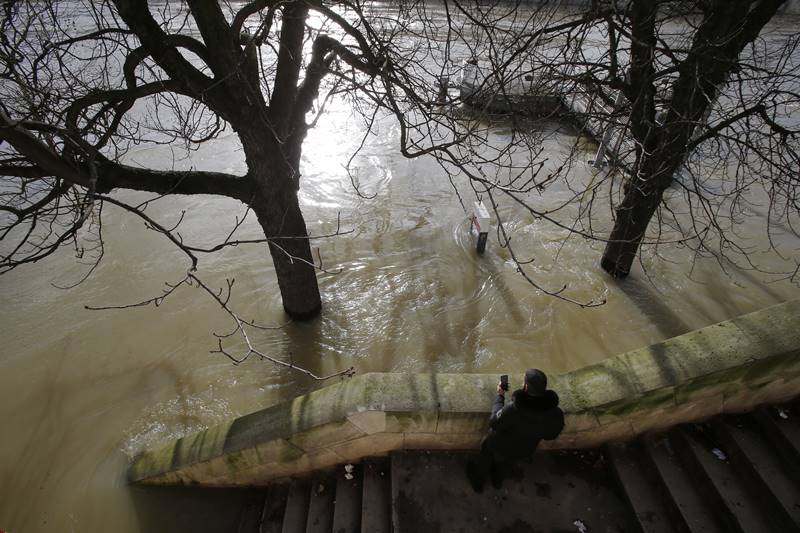 It has also resulted in the famous "Bateaux Mouches" tourist boats being shut down due to the high waters, swans swimming in places where there are usually pavements, and even rats being forced onto the streets of Paris due to the flood. (AP Photo)