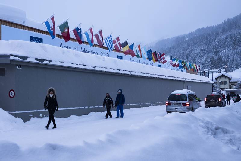 Schwab welcomed members from business, politics, academia and media as well as the first timers with a round of applause. (AP Photo)