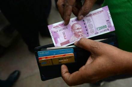 Rupee nears 64 level against US dollar, falls 14 paise