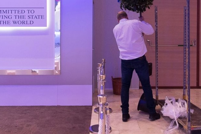 A worker places a plant during preparations for the 48th annual meeting of the World Economic Forum, WEF, in Davos, Switzerland. (AP)