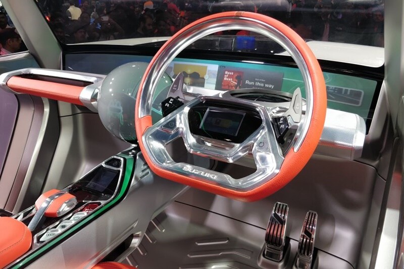 Maruti Suzuki's e-Survivor concept also gets a very futuristic dash board that doubles up as an infotainment display that stretches across the screen. The unique flat bottom steering however steals the show.