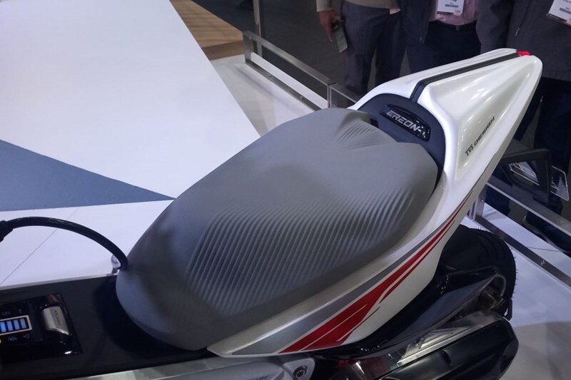 The seating on the new TVS Creon displayed at Auto Expo 2018 can accommodate two people easily and at the same time, it looks sporty in the light shade. The scooter has also been integrated with a phone charger and its under seat storage can accommodate a full face helmet.