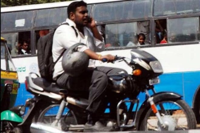 Not wearing a helmet is one thing while wearing it on elbow is another. You will find many people on the roads who feel too lazy to wear helmets on their heads and feel that their elbow is more important in terms of safety than their skull. We sure are not able to find a reason for this. Let us know in the comments section if you are one of them. (Image Credit: fakingnews.firstpost.com)