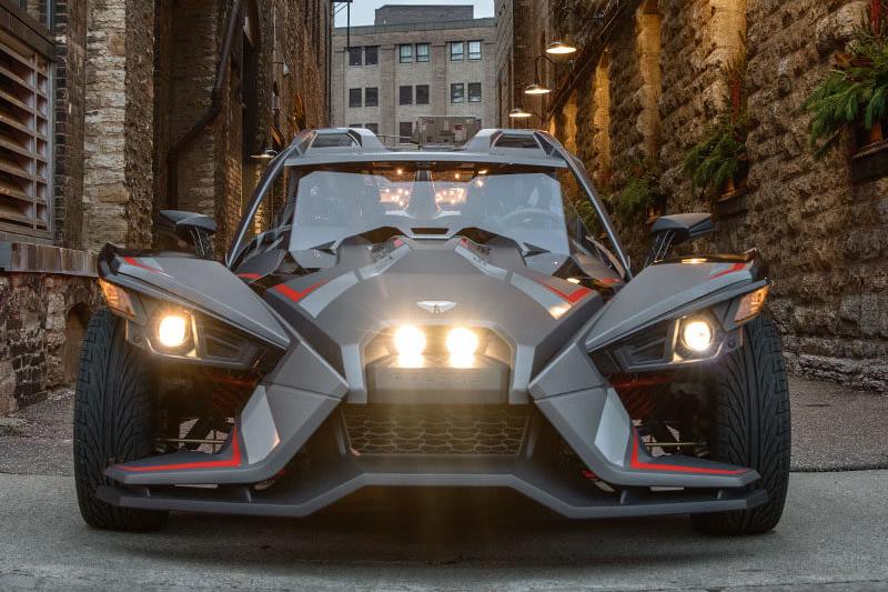 Now this Polaris Slingshot Grand Touring LE is a street legal vehicle and does make a statement with premium matte metallic paint, full body graphics, a color-matched rear fender, & painted interior accents. It does remind you of a superhero vehicle may be used by future RoboCop if not BatMan.