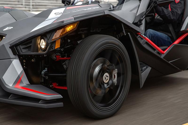 This three-wheeler lifestyle vehicle is available in Matte Cloud Gray & Indy Red and it includes Slingshade with accented graphics, color-matched rear fender, 18” front and 20“ rear black cast aluminum wheels.