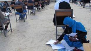 Jahantab Ahmadi, Jahantab Ahmadi baby, Jahantab Ahmadi rocking baby, Jahantab Ahmadi exam, afghan mom cradling baby, afghan mom exam, Jahantab Ahmadi exam, Jahantab Ahmadi baby exam