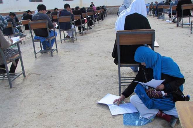 Jahantab Ahmadi, Jahantab Ahmadi baby, Jahantab Ahmadi rocking baby, Jahantab Ahmadi exam, afghan mom cradling baby, afghan mom exam, Jahantab Ahmadi exam, Jahantab Ahmadi baby exam
