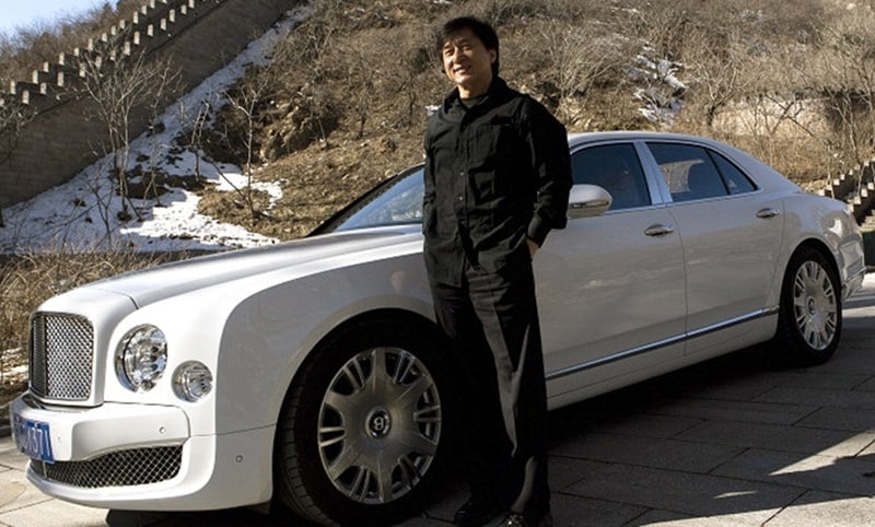 Bentley Mulsanne: Back in 2013, Jackie Chan teamed up with Bentley for an advertisement where he played a high-end chauffeur. During the short film, Jackie Chan told stories about his youth, spending money as it came in the 1980s, and how he has since become a dedicated philanthropist with a desire to help the needy. (Image: listhogs)