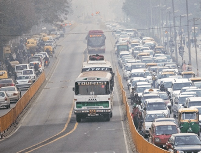 Cars and buses work their way through traffic in New Delhi. China and India may look like large pollutants, but if the amount of pollution is divided by the population and then compared with developed countries, one would get a very different picture, says the author (Bloomberg)