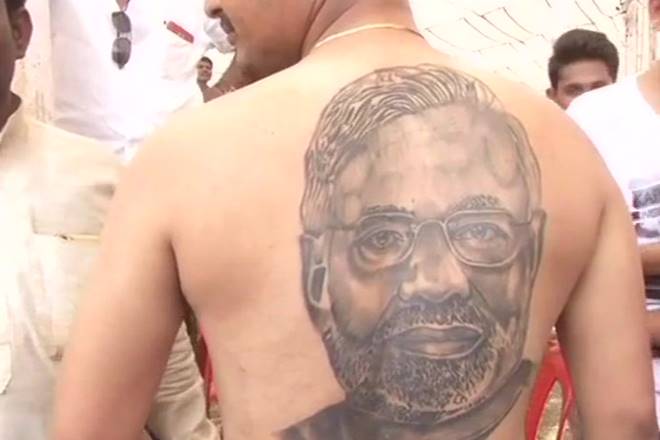 Man tattoos Modi on his back in Karnataka (Image: Twitter/ @ANI)