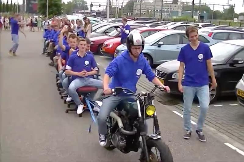Longest office chair train towed by a motorcycle: First of all, are office chairs a thing? They are if there are enough people with enough free time and enough free office chairs. That’s what students from Driestar College in the Netherlands did when, on June 22, 2016, 22 of them lined up a “train” of office chairs which were then pulled, albeit really slowly, by a vintage Yamaha scrambler.
