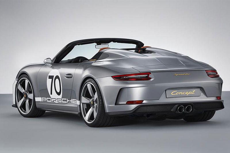 Top characteristics of the 911 Speedster Concept include the shorter window frame with a more inclined windscreen and correspondingly shortened side windows. Porsche's new concept sports car also gets the rear cover built in carbon fibre , covering a roll-over protection structure and featuring a ‘double bubble’, a traditional element of this sports car design since the 911 Speedster from 1988. Two contrasting black slats between the ‘humps’ add an aerodynamic touch, and a transparent Plexiglas wind deflector features an engraved ‘70 years of Porsche’ logo.