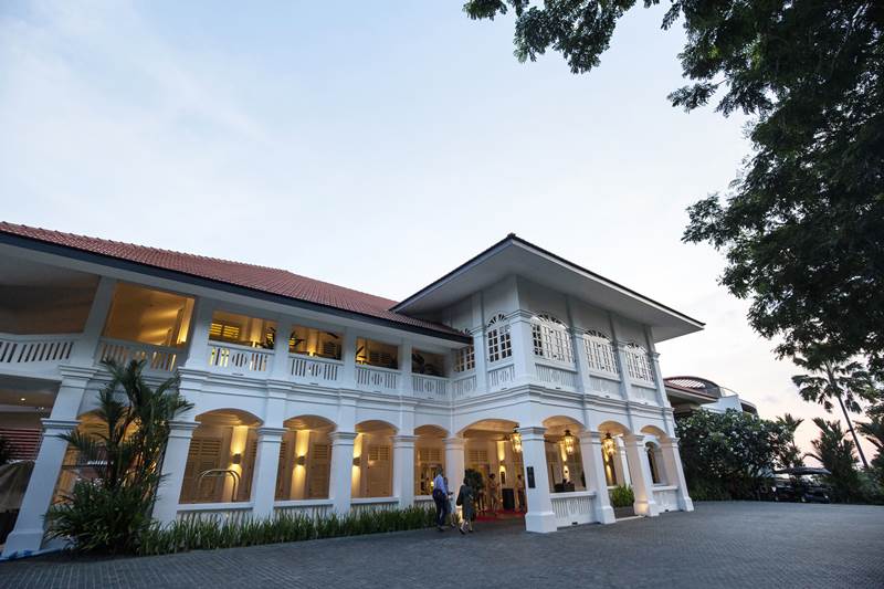 An entrance glows outside the Capella Hotel. The Singapore government has said police would make stricter checks of people and personal belongings and items such as public address systems and remotely piloted aircraft system would be prohibited in the area. (AP Photo)