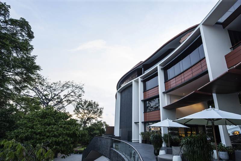 Table umbrellas line outside the Capella Hotel. White House spokeswoman Sarah Sanders said in a Twitter post on Tuesday that "the venue for the Singapore summit between @POTUS and Leader Kim Jong Un will be the Capella Hotel on Sentosa Island. We thank our great Singaporean hosts for their hospitality." (AP Photo)