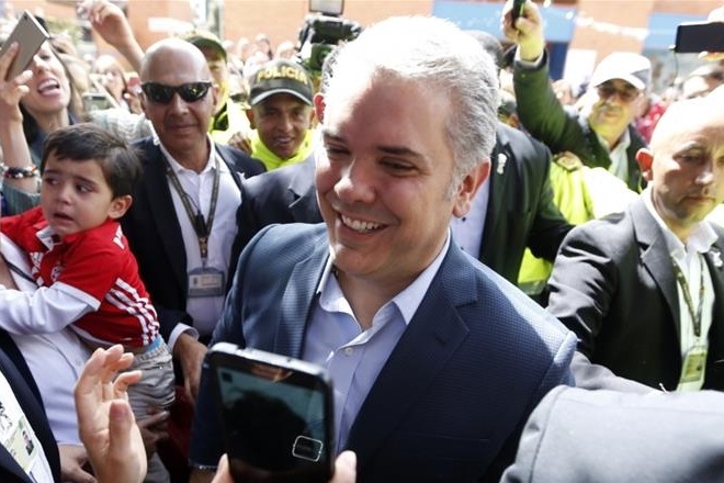 Duque surrounded by supporters after casting his vote in Bogota (Reuters) Duque surrounded by supporters after casting his vote in Bogota (Reuters)
