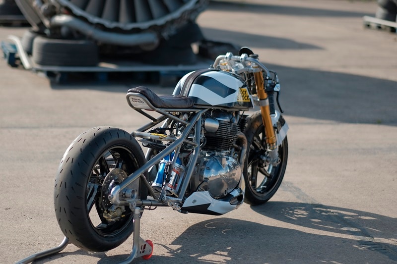 Its ‘Dazzle Camo’ paint job pokes fun at the tradition of motorcycle manufacturers camouflaging their prototypes. Also, it gets a minimalist carbon-fibre body and leather work.