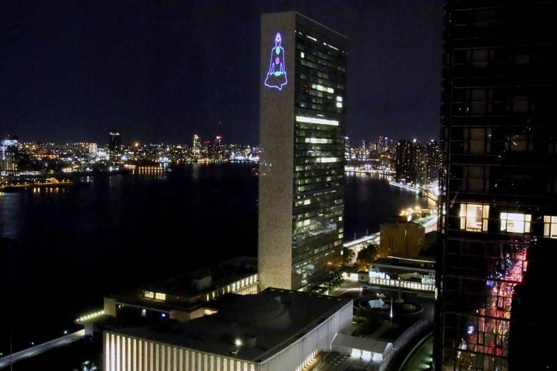 Yoga in US: A display of yoga postures through laser light beams on UN Secretariat wall to commemorate International Day of Yoga 2018, in New York, US on Tuesday, June 19, 2018. (PTI Photo)