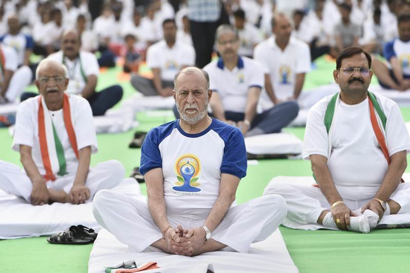 Delhi Lieutenant Governor Anil Baijal performs yoga during a mass yoga session on International Yoga Day 2018, at Rajpath in New Delhi, on Thursday, June 21, 2018. (PTI Photo)