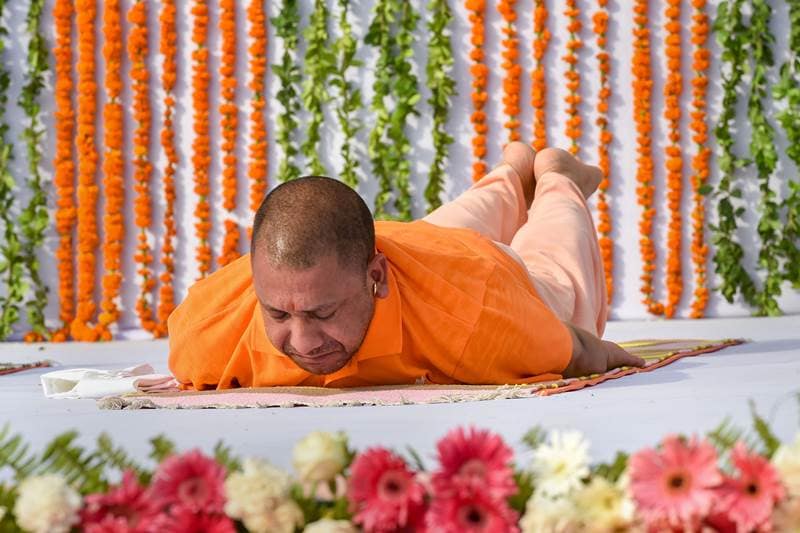 Uttar Pradesh Chief Minister Yogi Adityanath during the 4th International Yoga Day function at Raj Bhawan, in Lucknow on Thursday, June 21, 2018. (PTI Photo)