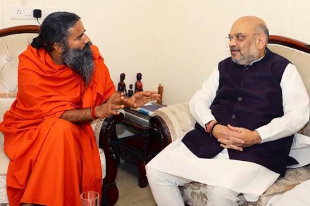 New Delhi: Bharatiya Janata Party (BJP) President Amit Shah meets yoga guru Baba Ramdev during his 'Sampark for Samarthan' campaign to generate awareness about the NDA government's achievements, in New Delhi on Monday, June 04, 2018. (PTI Photo) 
