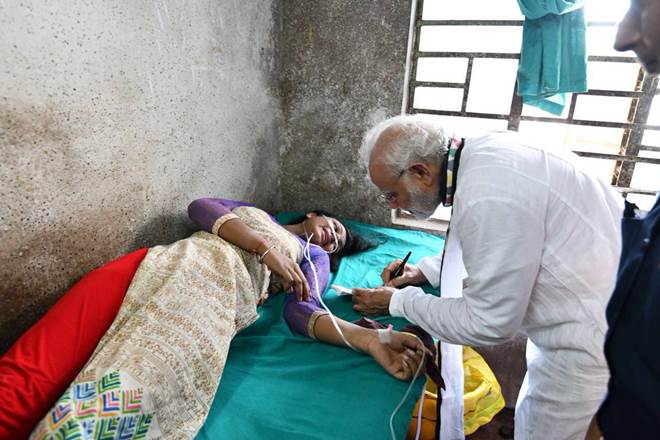 Pm Modi, Narendra Modi, Midnapore rally, Narendra Modi autograph, makeshift tent, tent collapsed, Pm Modi visits hospita, india Pm Modi, Narendra Modi, Midnapore rally, Narendra Modi autograph, makeshift tent, tent collapsed, Pm Modi visits hospita, india