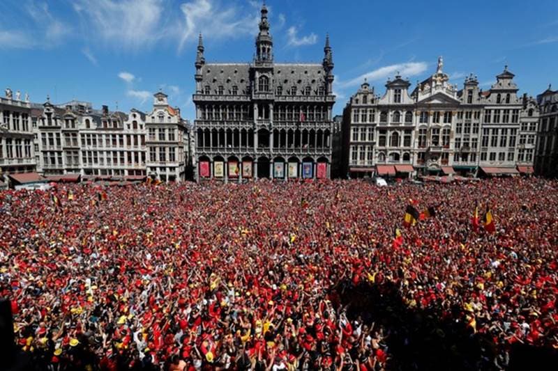 Belgian soccer team fans wait for the team to appear on the balcony of the city hall at the Brussels' Grand Place, after taking the third place in the World Cup 2018, in Brussels.