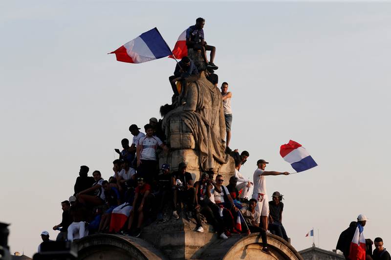 France fans during the parade. In Paris, the metro system temporarily renamed six of its stations in honour of the key players, with the Victor Hugo stop -- named after the famed 19th-century writer -- becoming Victor Hugo Lloris after the team's goalkeeper.