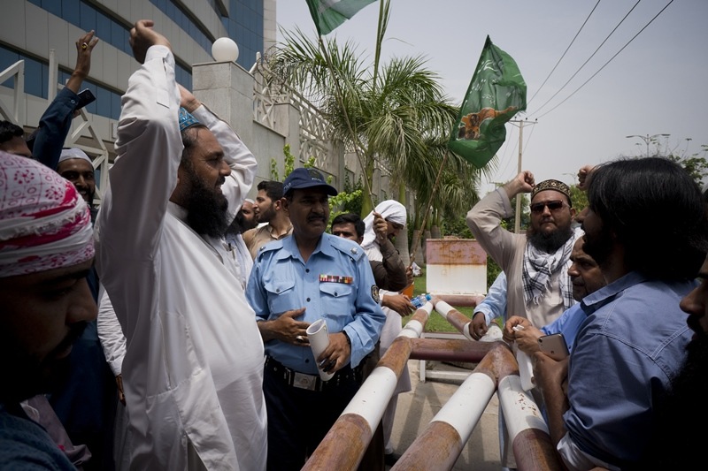 Supporters of Pakistani radical, religious and sectarian groups protest outside the office of the Pakistan Electronic Media Regulatory Authority, demanding that their election campaigns to be aired by media channels, in Islamabad.