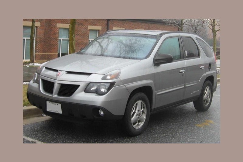 Pontiac Aztek Pontiac Aztek is one of the rare cars that practically violates every principle of a car's aesthetics. The car is slab-sided, has a hunchback and worst of all is the roller-skate-sized wheel size. This car is considered to be one of the ugliest car ever built. Pic credit: Freebase, public domain