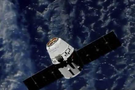 Station astronaut Ricky Arnold used a large mechanical arm to grab the Dragon capsule as the spacecraft soared above Quebec, Canada. (Nasa/AP)