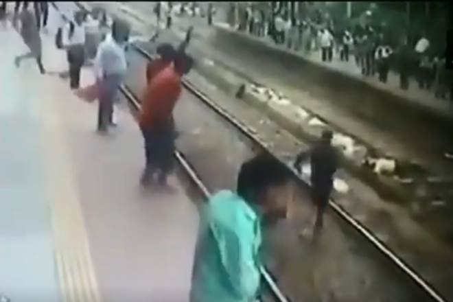 In a video which went viral, the man, identified as 54-year-old Narendra Kotekar, is seen stepping down from a platform at Kurla suburban railway station and lying down on a track yesterday afteroon. (Video grab from ANI)