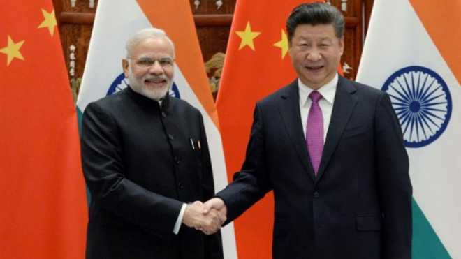 China and India will discuss the US' trade war and its protectionist trade policy when President Xi Jinping and Prime Minister Narendra Modi meet on the sidelines of the BRICS Summit in Johannesburg next week, the Chinese Foreign Ministry said on Friday. (Reuters)