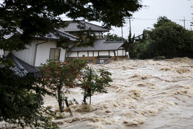 Several days of heavy rainfall that weather officials have called historic set off flooding and landslides in widespread areas of western Japan, including Hiroshima, Okayama and Ehime prefectures. (Reuters)