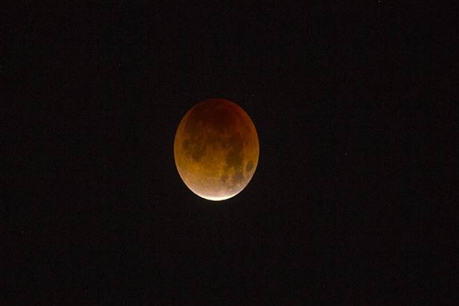 The celestial spectacle, which would be seen in its entirety from all parts of India, last for 1 hour 43 minutes, making it the longest total lunar eclipse of this century (2001 AD to 2100 AD), the Ministry of Earth Science had said. (Representational photo: AP) The celestial spectacle, which would be seen in its entirety from all parts of India, last for 1 hour 43 minutes, making it the longest total lunar eclipse of this century (2001 AD to 2100 AD), the Ministry of Earth Science had said. (Representational photo: AP)
