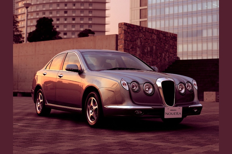 Mitsuoka Nouera The Nouera was based on the Honda Accord platform. The 4-door sedan does get 'classic' English car looks but the weirdly shaped lights did spoil the overall design.