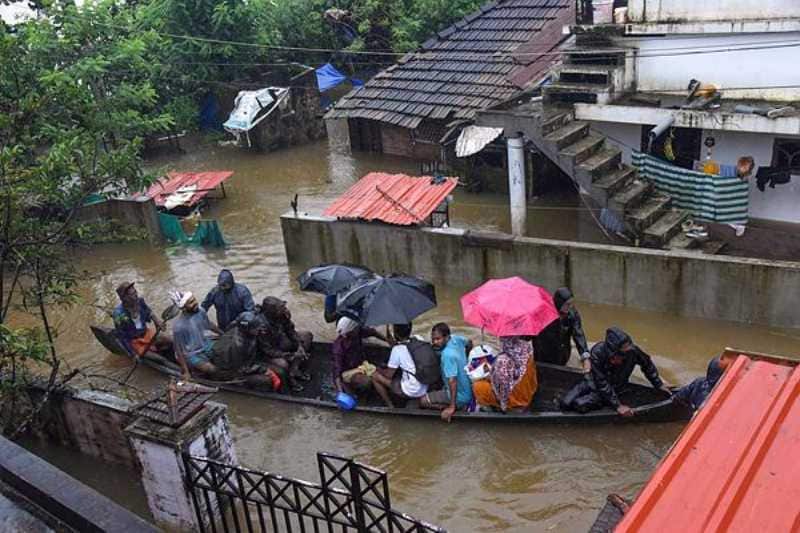 2- Kochi: Rescue officials assist villagers out of a flooded area following heavy monsoon rainfall, near Kochi on Wednesday, Aug 15, 2018. (PTI)