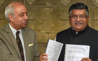Justice BN Srikrishna hands over the report to IT Minister RS Prasad. (File photo: PTI)