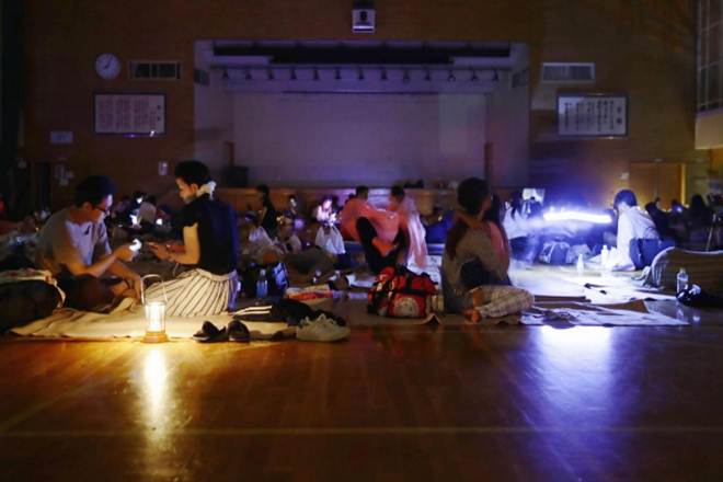 Evacuees are seen at a gymnasium of elementary school, acting as an evacuation shelter (Image: Reuters)