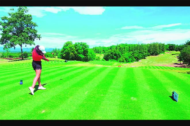 Lady pro Tvesa Malik dispatches the ball deep down the 10th fairway at the Banyan Golf Club in Hua Hin, Thailand