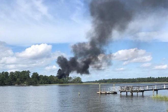 Smoke rises at the site of a F-35 jet crash (Image: Reuters) Smoke rises at the site of a F-35 jet crash (Image: Reuters)