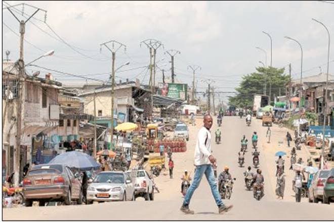 A pedestrian in downtown Kribi, Cameroon, one of the countries in the Sahel region that the author focuses on (Bloomberg)