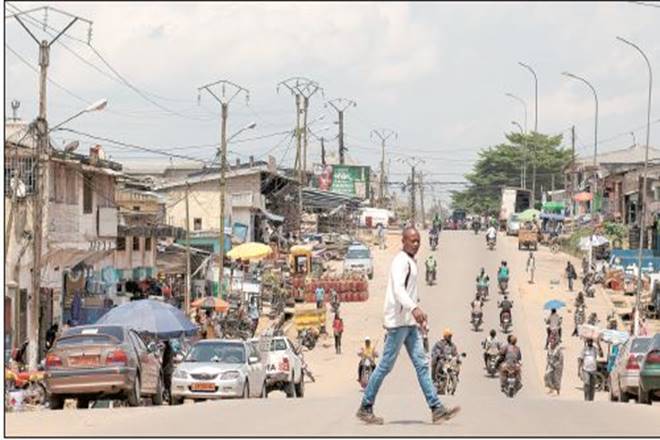A pedestrian in downtown Kribi, Cameroon, one of the countries in the Sahel region that the author focuses on (Bloomberg)
