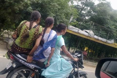 Women riders beware! Not wearing a helmet will surely land you in trouble now