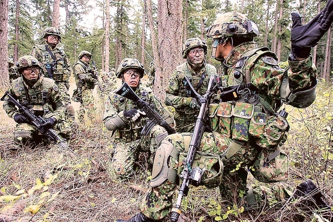 The constitutional revision purports to clarify and formalise the legal status of Self-Defense Forces (in photo). Japan is mired in a debate how to retain the core essence of Article 9 (no war, no standing army) but seek a clarity on the legal status of SDF.