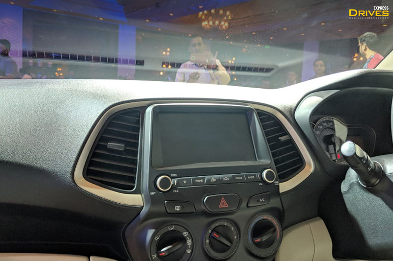 On the inside, new Hyundai Santro is well-equipped with a 7-inch touchscreen infotainment system that supports smartphone connectivity through Apple CarPlay, Android Auto, and MirrorLink. It also gets a rear parking camera and voice recognition.