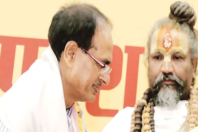 Addressing a gathering of about 1000 seers from 13 Akharas (spiritual denominations) in Indore Tuesday, the godman appealed to uproot the BJP government in the November 28 polls. (IE) Addressing a gathering of about 1000 seers from 13 Akharas (spiritual denominations) in Indore Tuesday, the godman appealed to uproot the BJP government in the November 28 polls. (IE)